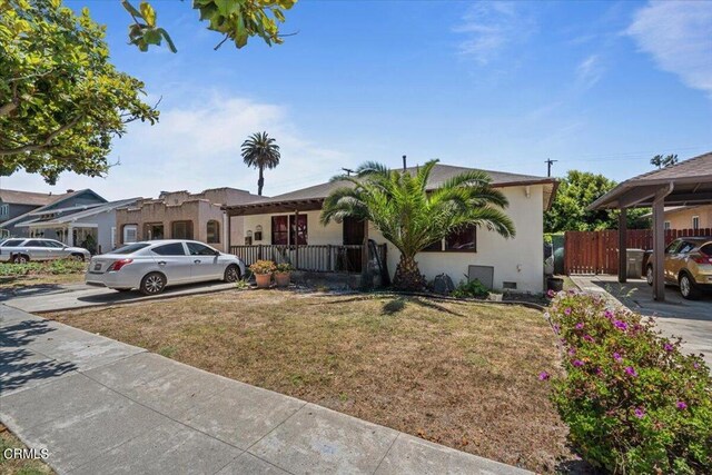 single story home with a front lawn