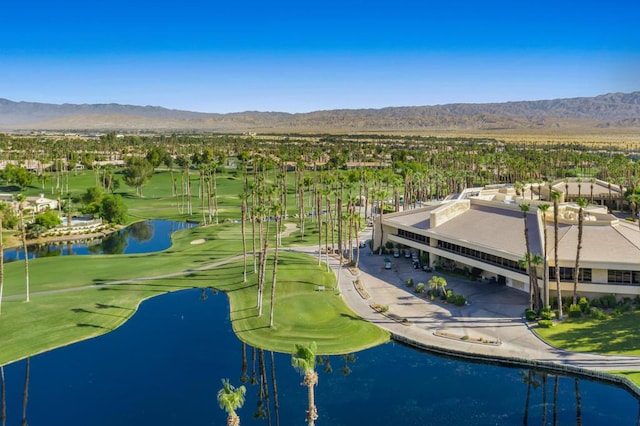 birds eye view of property featuring a water and mountain view