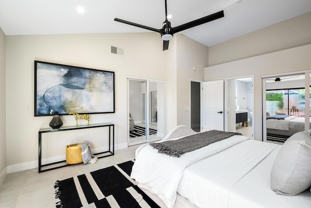 bedroom with lofted ceiling, connected bathroom, and ceiling fan