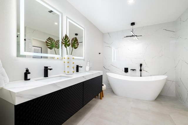 bathroom with a bathing tub and vanity