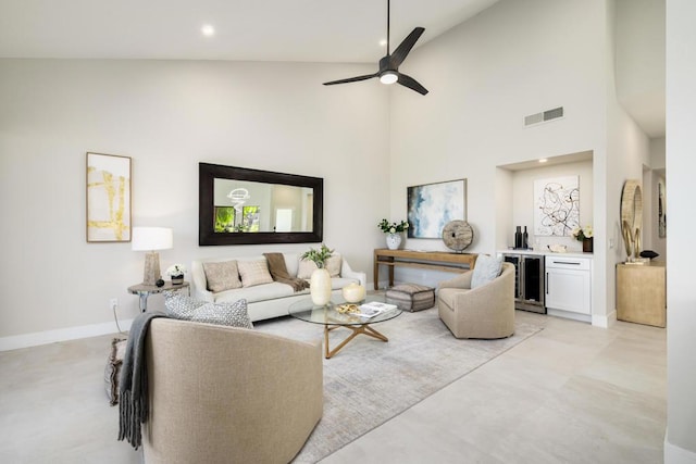 living room featuring ceiling fan, beverage cooler, and high vaulted ceiling