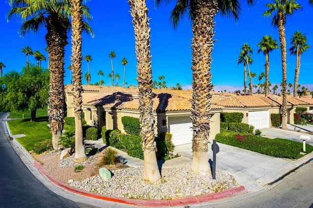 mediterranean / spanish-style home featuring a garage