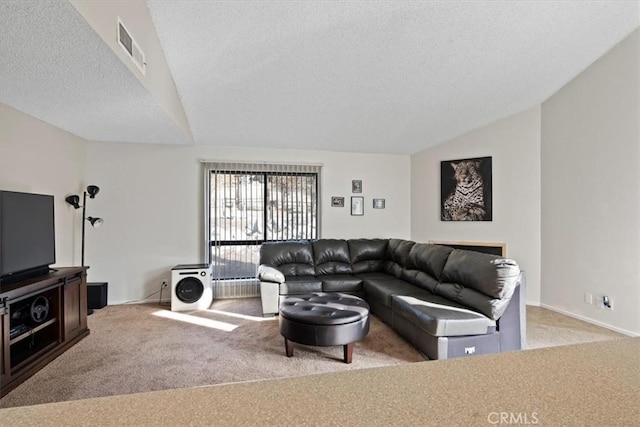 living room with a textured ceiling, light carpet, and vaulted ceiling