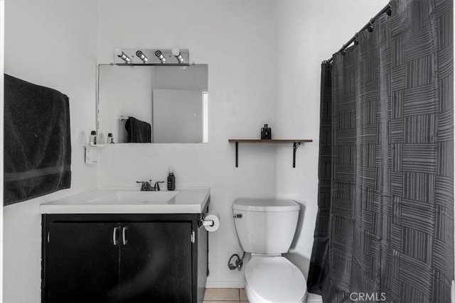 bathroom with toilet, vanity, a shower with curtain, and tile patterned flooring