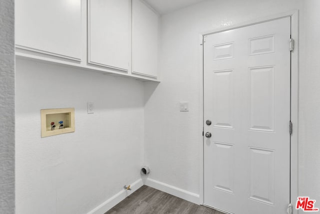 laundry room featuring washer hookup, cabinets, dark hardwood / wood-style floors, and gas dryer hookup