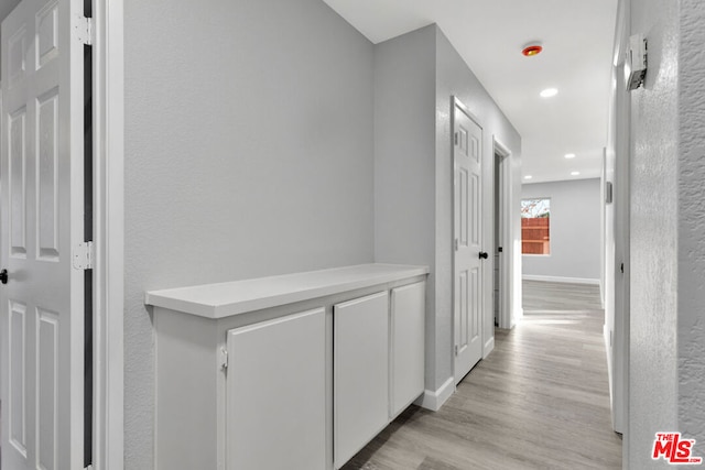 corridor featuring light hardwood / wood-style floors