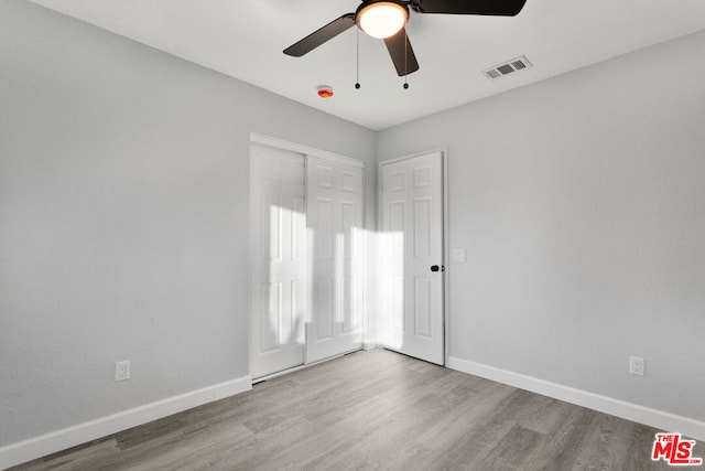 unfurnished room featuring ceiling fan and light hardwood / wood-style flooring