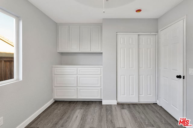 unfurnished bedroom featuring hardwood / wood-style flooring