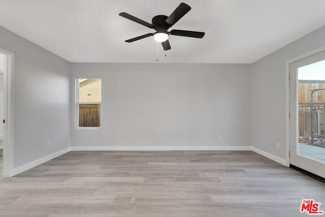 unfurnished room with ceiling fan and light hardwood / wood-style floors