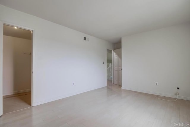 unfurnished room featuring light hardwood / wood-style flooring