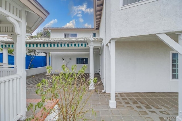 view of home's exterior with a patio area and a pergola