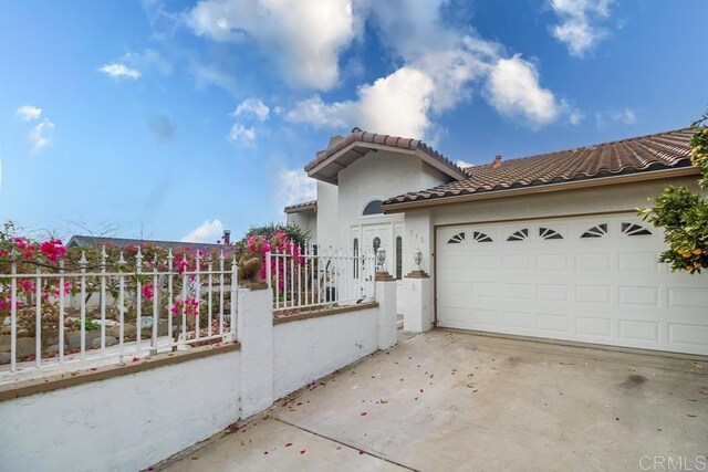 view of property exterior featuring a garage