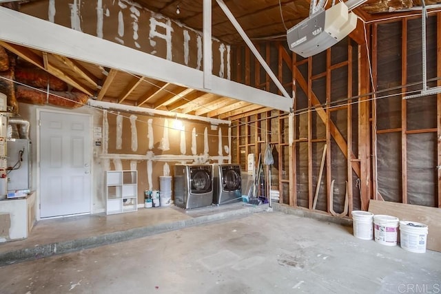 misc room with washer and dryer and concrete floors