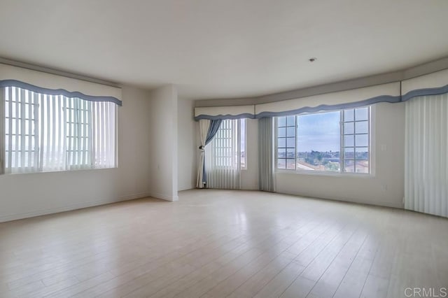 unfurnished room featuring light hardwood / wood-style flooring