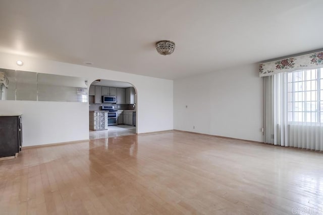 unfurnished living room with light wood-type flooring