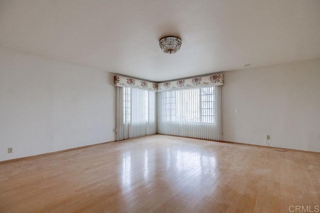 spare room featuring light hardwood / wood-style flooring