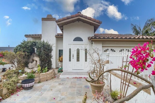 property entrance with a garage