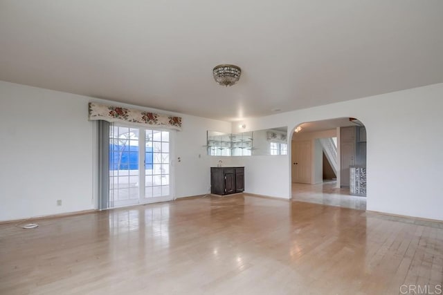 unfurnished living room featuring light wood-type flooring