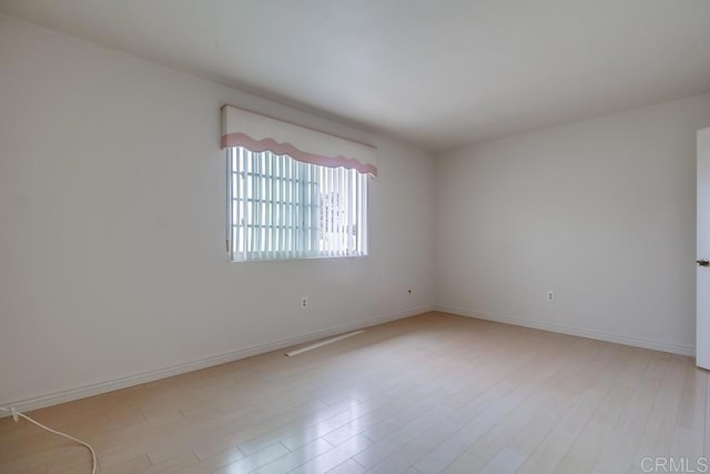 unfurnished room featuring light hardwood / wood-style flooring