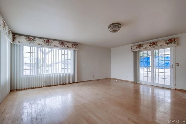 unfurnished room featuring light wood-type flooring