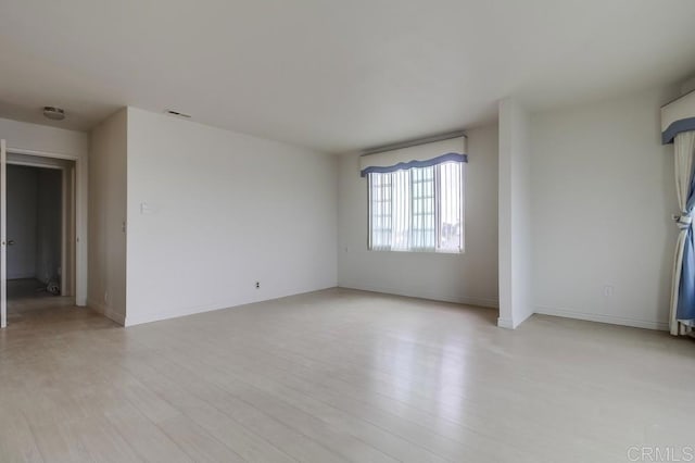 unfurnished room featuring light hardwood / wood-style flooring