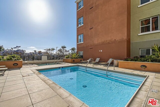 view of pool with a patio area