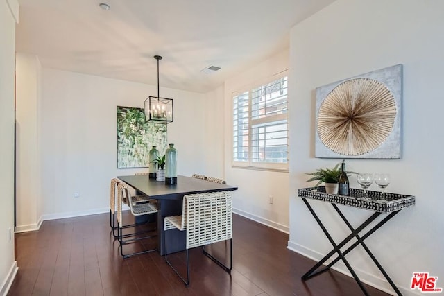 dining area featuring dark hardwood / wood-style flooring