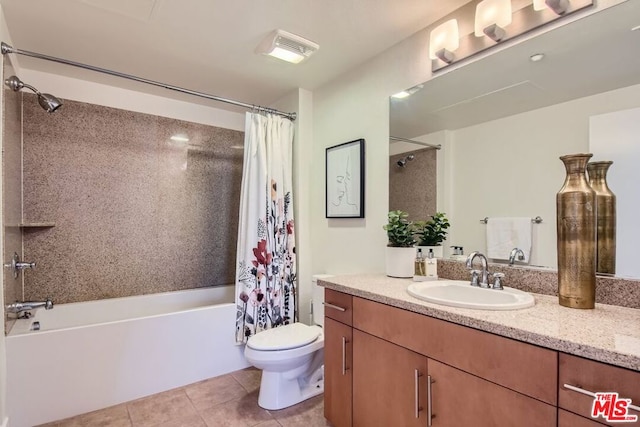 full bathroom featuring toilet, vanity, tile patterned flooring, and shower / bathtub combination with curtain