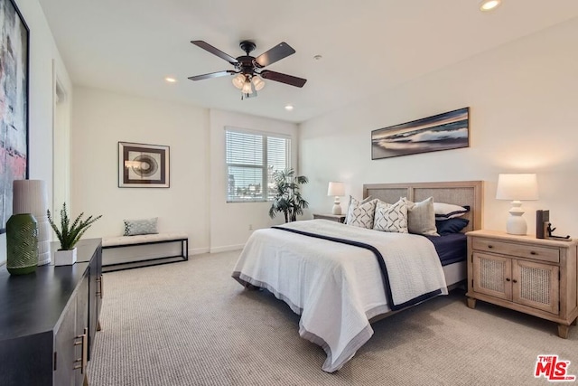 bedroom with light carpet and ceiling fan