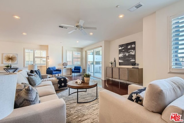 living room with ceiling fan and wood-type flooring