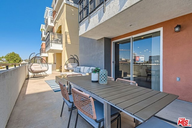 view of patio / terrace featuring an outdoor living space and a balcony