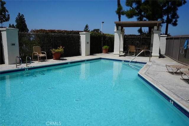 view of swimming pool featuring a patio area