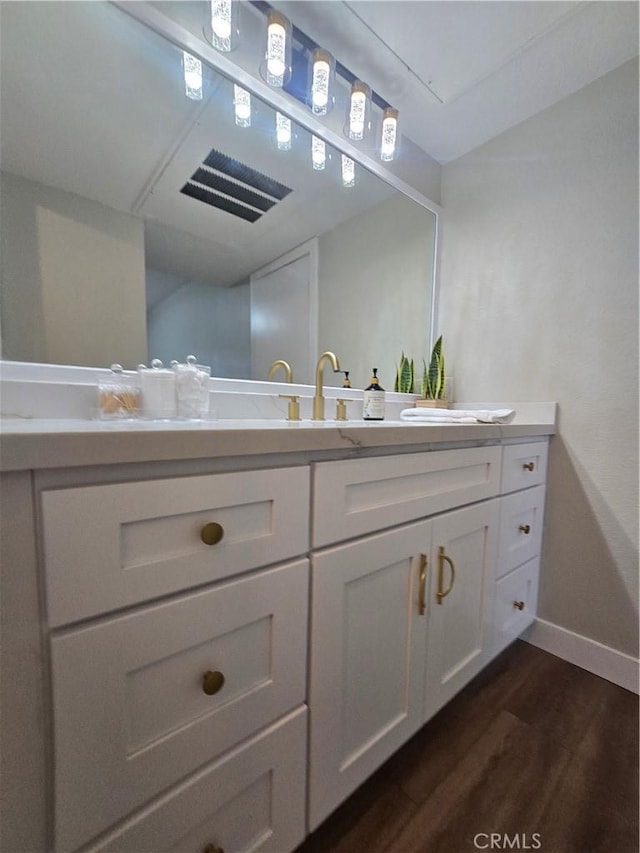 bathroom featuring wood-type flooring and vanity