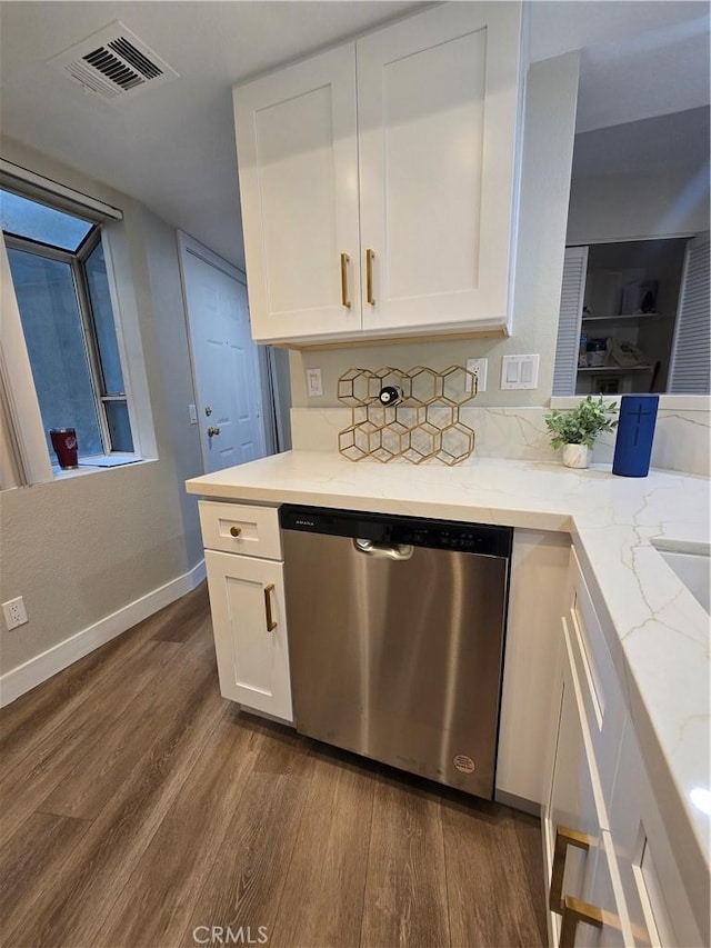 kitchen featuring light stone counters, white cabinets, dishwasher, and dark hardwood / wood-style flooring