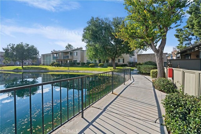 view of home's community with a water view