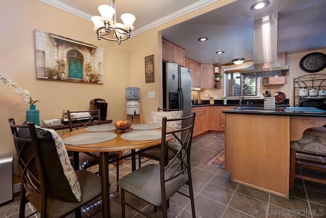 dining area featuring ornamental molding and a notable chandelier