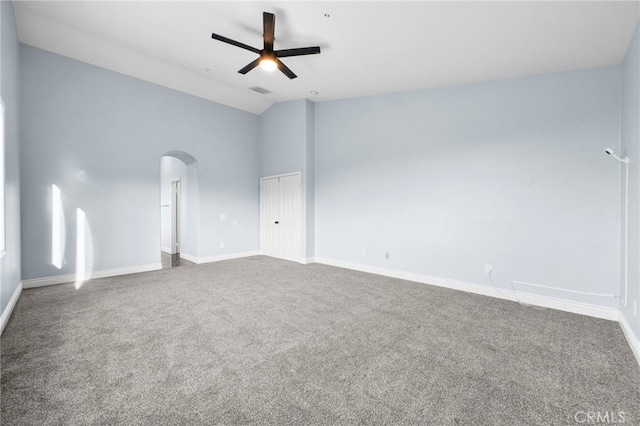 unfurnished room featuring carpet floors and high vaulted ceiling