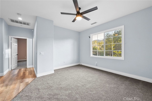 unfurnished room featuring ceiling fan and carpet floors