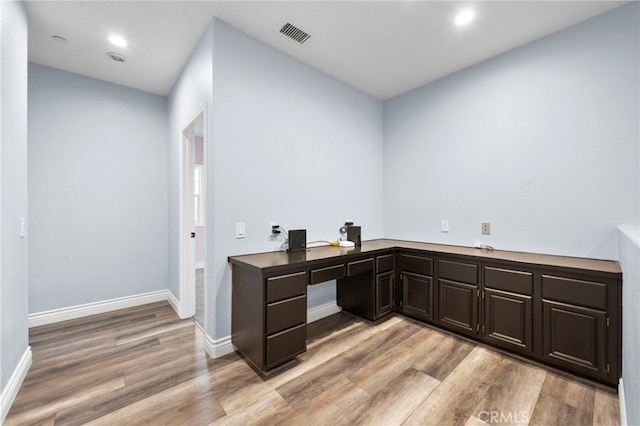 office space with light wood-type flooring