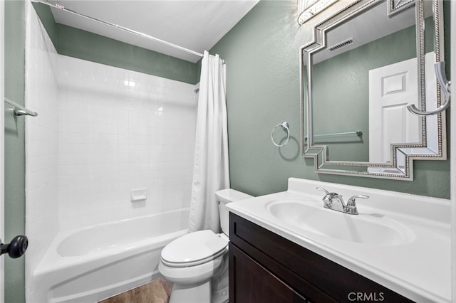 full bathroom with hardwood / wood-style floors, toilet, vanity, and shower / bath combination with curtain