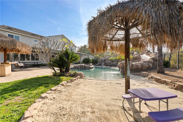 view of home's community featuring a patio area and a swimming pool