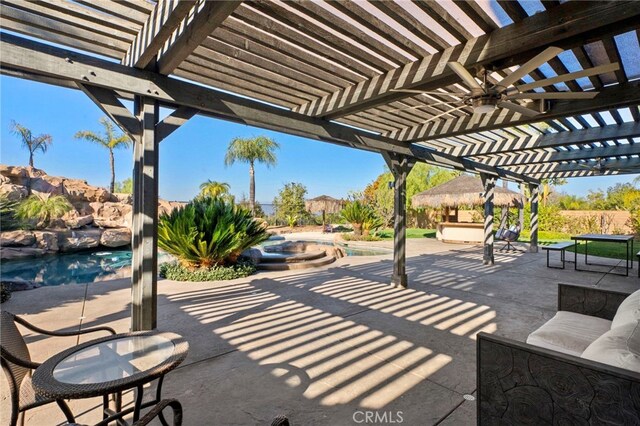 view of patio / terrace featuring ceiling fan and a pergola