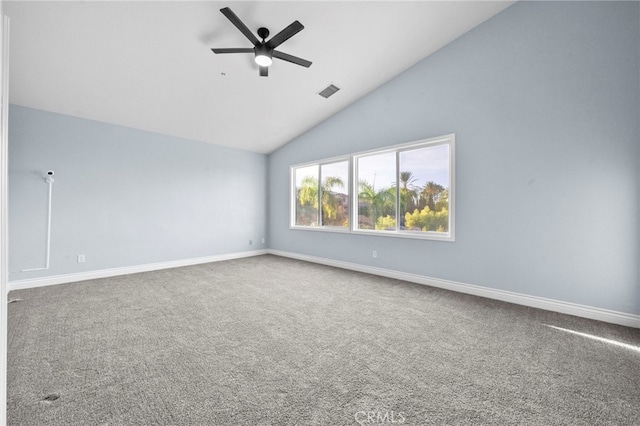 carpeted empty room with vaulted ceiling and ceiling fan