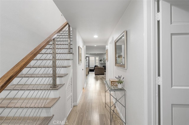 stairway featuring hardwood / wood-style flooring