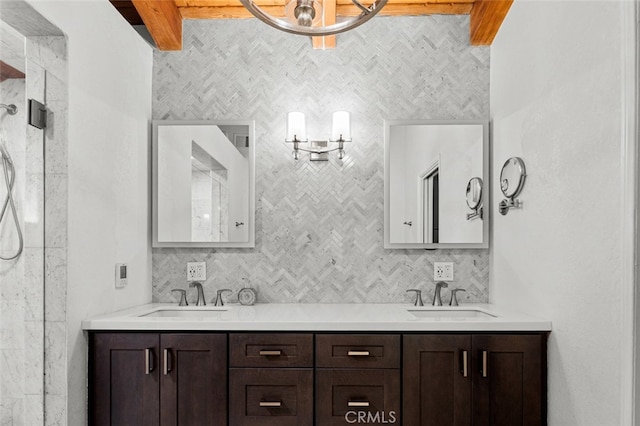 bathroom featuring vanity and beamed ceiling