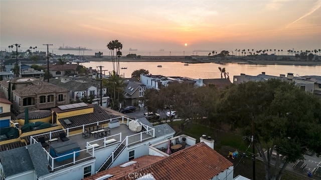 aerial view at dusk with a water view