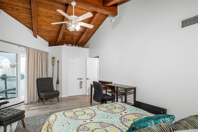 bedroom featuring wooden ceiling, access to exterior, beam ceiling, and hardwood / wood-style floors