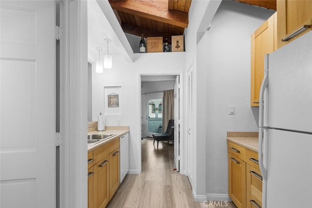 bathroom featuring wooden ceiling, hardwood / wood-style floors, sink, and beam ceiling