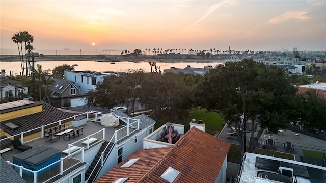 aerial view at dusk with a water view