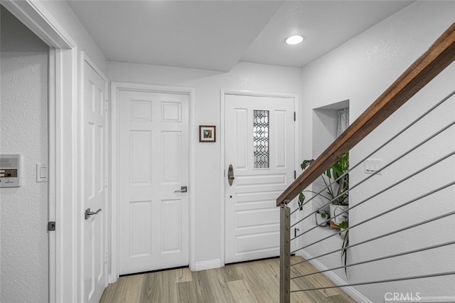 foyer with light hardwood / wood-style floors